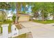 Charming home with well-maintained landscaping, mature trees, and a welcoming driveway at 635 Painted Leaf Dr, Brooksville, FL 34604