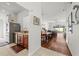 Hallway view connects kitchen, dining, and living areas with an open layout, showcasing modern stainless steel appliances at 635 Painted Leaf Dr, Brooksville, FL 34604