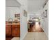 Open hallway leading to dining and living room areas, seamlessly connecting the kitchen with a view to the backyard at 635 Painted Leaf Dr, Brooksville, FL 34604