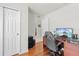 Comfortable home office featuring wood floors, a desk, and views to other rooms at 635 Painted Leaf Dr, Brooksville, FL 34604