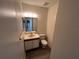 Cozy bathroom featuring a vanity and a toilet with neutral tones at 6440 Spring Flower Dr # 14, New Port Richey, FL 34653