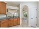 Kitchen with tile floors, granite countertops, and stainless steel appliances at 7500 Red Mill Cir, New Port Richey, FL 34653