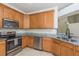 Kitchen featuring stainless steel appliances, ample cabinet space and granite countertops at 7500 Red Mill Cir, New Port Richey, FL 34653