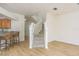 View of the staircase with breakfast bar looking into kitchen at 7500 Red Mill Cir, New Port Richey, FL 34653