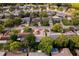 Drone's-eye view displays lush landscaping, mature trees, and a serene neighborhood setting at 8505 Lincolnshire Dr, Hudson, FL 34667