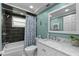 Bathroom with blue tile accents, marbled vanity, and a shower with a patterned curtain at 8505 Lincolnshire Dr, Hudson, FL 34667