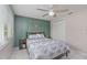 Comfortable bedroom with ceiling fan, decorative wall art, and closet at 8505 Lincolnshire Dr, Hudson, FL 34667