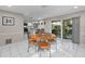 Open floorplan with a view of the kitchen and sliding glass doors with a view at 8505 Lincolnshire Dr, Hudson, FL 34667