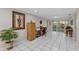 Bright home office with neutral walls, tile floors, and sliding glass doors to the backyard at 8505 Lincolnshire Dr, Hudson, FL 34667