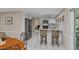 Kitchen with stainless appliances, breakfast bar and tile flooring at 8505 Lincolnshire Dr, Hudson, FL 34667