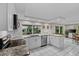 Bright kitchen features stainless appliances, white cabinets and granite countertops at 8505 Lincolnshire Dr, Hudson, FL 34667