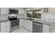Kitchen with stainless steel appliances and granite countertops at 8505 Lincolnshire Dr, Hudson, FL 34667