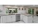 Updated kitchen with granite countertops and stainless steel dishwasher at 8505 Lincolnshire Dr, Hudson, FL 34667