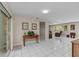 Bright living room with tile flooring and view to secondary Gathering room at 8505 Lincolnshire Dr, Hudson, FL 34667