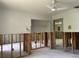Bedroom with ceiling fan, showcasing unfinished walls ready for customization at 8711 Cutlass Dr, Hudson, FL 34667