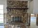 Close-up of the living room fireplace showcasing the stone details and mantle at 8711 Cutlass Dr, Hudson, FL 34667
