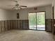 Open living area with sliding glass door, providing views and abundant natural light at 8711 Cutlass Dr, Hudson, FL 34667