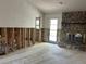 Spacious living room featuring a stone fireplace with a raised hearth, awaiting customization at 8711 Cutlass Dr, Hudson, FL 34667