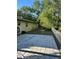 Fenced backyard with a large concrete patio at 8711 Cutlass Dr, Hudson, FL 34667
