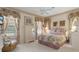 Charming bedroom with floral bedding, a dresser, and a cozy chair for a relaxing retreat at 9147 Rhett Ln, Weeki Wachee, FL 34613