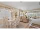 Bright dining room with a glass table and ornate furnishings, with seamless flow to living spaces at 9147 Rhett Ln, Weeki Wachee, FL 34613