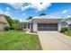 Charming single-story home with a well-maintained lawn and attractive landscaping at 9147 Rhett Ln, Weeki Wachee, FL 34613