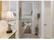 Hallway featuring tile floors, neutral color palette and stylish light fixtures at 9147 Rhett Ln, Weeki Wachee, FL 34613
