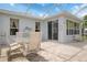 Inviting screened patio with a stylish table and chairs, creating an ideal outdoor entertaining space at 9147 Rhett Ln, Weeki Wachee, FL 34613