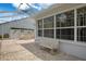 Spacious screened patio with comfortable seating, perfect for enjoying the outdoor scenery and relaxing at 9147 Rhett Ln, Weeki Wachee, FL 34613