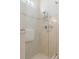 Frameless shower with tile surround, shower head, and accessories at 9147 Rhett Ln, Weeki Wachee, FL 34613