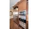 The kitchen features stainless steel appliances including a refrigerator, microwave, and oven at 10019 Milano Dr, Trinity, FL 34655