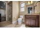 Tiled bathroom with glass shower and granite topped vanity at 10019 Milano Dr, Trinity, FL 34655