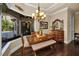 Dining room with a window view and wooden table set and a decorative dresser at 10019 Milano Dr, Trinity, FL 34655