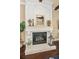 Close up view of a stone fireplace with decorative mantelpiece, offering a cozy ambiance at 10019 Milano Dr, Trinity, FL 34655