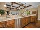 Kitchen with stainless steel dishwasher, wooden cabinets, and granite countertop at 10019 Milano Dr, Trinity, FL 34655