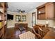 Well-appointed office with custom built-ins, hardwood floors, and ample natural light at 10019 Milano Dr, Trinity, FL 34655