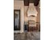 Outdoor grill area with stone hood, beverage cooler, and granite countertop at 10019 Milano Dr, Trinity, FL 34655