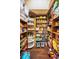 Walk-in pantry with lots of storage space featuring adjustable shelves and ample room at 10019 Milano Dr, Trinity, FL 34655