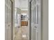 Ensuite bathroom with tiled floors, and luxurious bath and shower at 10109 Holly Berry Dr, Spring Hill, FL 34613