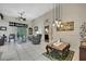Spacious and inviting living room featuring neutral tile flooring, modern stylish furniture, and high ceilings at 10109 Holly Berry Dr, Spring Hill, FL 34613