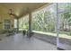 Enclosed back porch overlooking the lush greenery at 10109 Holly Berry Dr, Spring Hill, FL 34613