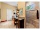 Neutral bathroom showcasing a walk-in shower, granite countertop vanity, and ceramic tile flooring at 10645 Fawn Dr, New Port Richey, FL 34654