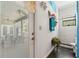Bright bathroom featuring modern gray tiling in walk-in shower and a decorative plant at 10645 Fawn Dr, New Port Richey, FL 34654