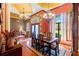Elegant dining room featuring hardwood floors, decorative lighting, and a formal dining set with seating for six at 10645 Fawn Dr, New Port Richey, FL 34654