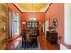 Formal dining room boasting hardwood floors, designer lighting, and a built-in cabinet for displaying fine china at 10645 Fawn Dr, New Port Richey, FL 34654