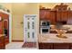 Stylish kitchen with custom cabinetry, granite countertops, stainless steel appliances, and a view to the outside at 10645 Fawn Dr, New Port Richey, FL 34654