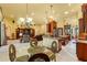 Open concept living space with a modern kitchen, dining area, and comfortable living room with lots of light at 10645 Fawn Dr, New Port Richey, FL 34654
