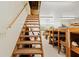 View of the storage room from the staircase with built in shelving and plenty of room for storage at 10645 Fawn Dr, New Port Richey, FL 34654
