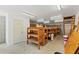 Storage room with built in wooden shelving, concrete floors, block walls, and a white exterior door at 10645 Fawn Dr, New Port Richey, FL 34654