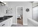 Bathroom with granite countertop sink and view into the bedroom space at 10712 Pontofino Cir, Trinity, FL 34655